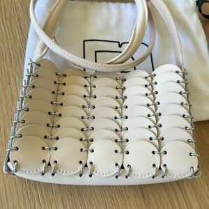 RABANNE
Laser-cut leather shoulder bag